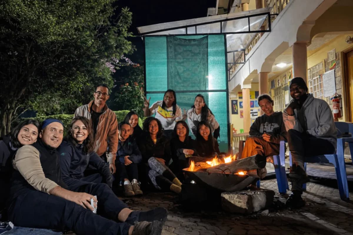 A group of travellers gathered around a fire