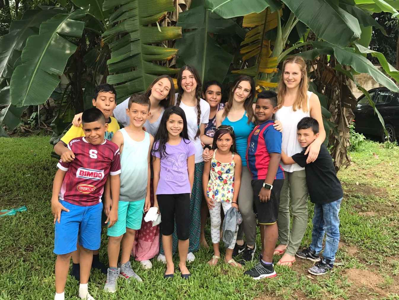 Volunteers and children during an educational activity